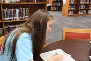 Junior Lauren Milam takes a practice PSAT during lunch. Photo by Pranathi Chitta.