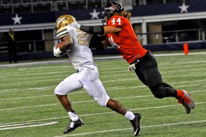 Senior linebacker Bo Anderson makes a stop against the Desoto Eagles. Coppell lost the game 51-35 on Nov. 13 at AT&T stadium. Photo by Sarah VanderPol.