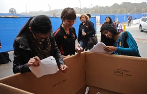 Student Council member Taylor Stiff helps record the turkeys donated at Coppell High School's 19th annual Turkey Drive. The drive was hosted Nov. 21; families could donate online or in person. Photo by Sarah VanderPol.