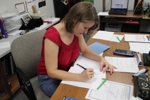 Mrs. Kosh carefully works on the answer key to the assignment her students are currently working on during second period in her classroom on November 7, 2014. Photo by Amanda Hair.