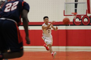 Sophomore Robin Kim passes the ball to a teammate in a game against Garland Sasche on Dec. 9. The game resulted in a 50-43 Cowboys loss.