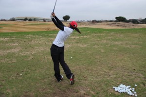 Senior Sol Lee perfects her golf swing during practice at Hackberry Creek on Dec. 3. Lee practices an hour to two hours everyday. 