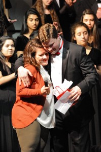 The Coppell Choir Booster Club presents choir director Joshua Brown with a gift at the Coppell Choir Winter Concert on Dec. 11 in appreciation for all he has done for the program in his time here at CHS.