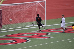 Junior Scott Simigian scores in the second half against WT White to add to Coppell's dominating 11-1 victory. Photo by Kelly Monaghan.