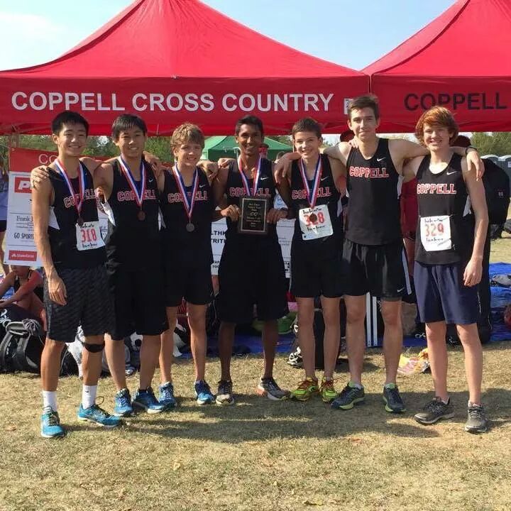 Senior Josh Thomas (center) and the varsity cross country boys team at the district meet receive third place qualify for regionals on Oct. 23.