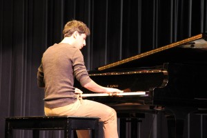 Pablo romo plays the piano saturday night during the talent show. Romo wows the crowd with his talent and great song choice. Photo By Chelsea Banks 