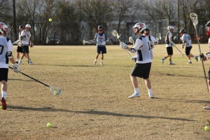 Senior Ben Dodson throws the ball during a practice on Jan. 16. Lacrosse equipment can cost over $1,000. Photo by Mallorie Munoz.