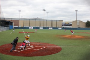 Sophomore pitcher John Kodros pitches against Midland third baseman Jacob Mata. Coppell lost 1-0 to Midland on March 14 at Highland Park High School. Photo by Nicole Messer.