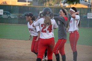 The young Cowgirls celebrate their big win over Haltom and look forward to the playoffs.