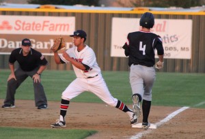 Junior first baseman Marco Navarro records a putout against Colleyville Heritage's Joseph Huff. Coppell won the game 3-0 on April 21. Photo by Kelly Monaghan.