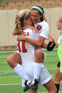 Senior Grace Vowell hugs junior teammate Shay Johnson after defeating San Antonio Reagan 1-0 during the state semifinals at Georgetown High School. The state championship game will be held tomorrow at Georgetown High School at 4 p.m. Photo by Sarah VanderPol.