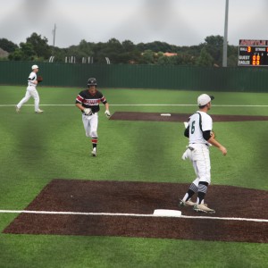 Sophomore infielder Jacob Nesbit sprints towards third base during Friday night’s playoff game against Southlake at Argyle High School. This was the Cowboys second playoff game versus Southlake, they played each other Thursday night and the Cowboys lost 0-6. Photo by Aubrie Sisk. 