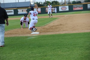 Senior pitcher Jensen Elliot shovels a ground ball to first base in the second inning of Coppell's 11-1 rout of Haltom in the final regular season game. Through five innings of work, Elliot recorded five strikeouts and only allowed three hits and one run. Photo by Shivani Burra.