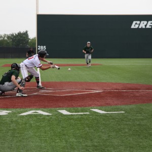 Junior Myles Paschall lays down a bunt in the fifth inning of the Cowboys' 3-2 loss to Southlake Carroll. With a double in the first inning, Paschall had one of Coppell's four hits in the game. Photo by Shivani Burra.