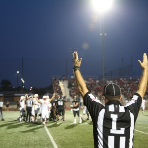 The Cowboys celebrate after scoring a touchdown in the second quarter of the game against the Hebron Hawks. The Cowboys played Friday night and won 26-20. Photo by Aubrie Sisk.