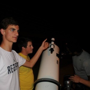  Coppell High School Senior Daniel Difrancesco and his team teach Earth and Space Science students about the telescope the science department has named ‘the Beast’ at the star party on Wednesday in the CHS parking lot. “It’s a reflector telescope making it more precise because of all of the mirrors inside of it,” Difrancesco said. Photo by Alexandra Dalton. 