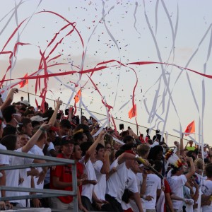 The Coppell student section cheers on the football team as they begin their first home game of the season on Friday, September 4. The Cowboys defeated Mckinney Boyd with a 20 point lead and a final score of 34-14. Photo by Amanda Hair.