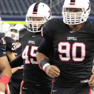 Solomon Thomas and teammates run out onto the field of AT&T Stadium for their playoff game against Desoto in 2014. Staff photo.