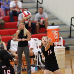 Junior outside hitter Jordan Scott passes the ball to a teammate during the Tuesday night game against LD Bell. The Cowgirls won the match 3-0 at home. Photo by Amanda Hair.