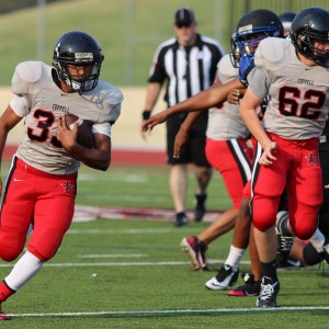 Coppell JV Black running back Sunny Singh scores the only Cowboy touchdown on Aug. 27 at Buddy Echols Field against Hebron High School. Singh ran the ball 37 yards to help the Cowboys win 7-6.