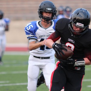 Coppell Cowboys JV Red tight end Connor Salerno runs 25 yards after a 20 yard pass to score the first Cowboy touchdown Aug. 27 at Buddy Echols Field to help the Cowboys win 27-13 over Hebron. 