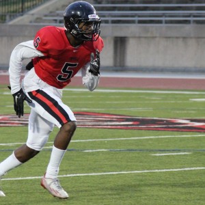 Coppell High School JV Red sophomore Kolbe Branch carries in the Cowboys’ 31-0 victory over L.D. Bell on Sept. 24 at Buddy Echols Field. 