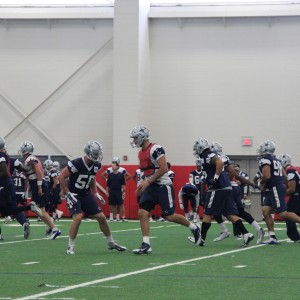 The Dallas Cowboys practice in the newly renovate Coppell High School fieldhouse on Friday.Wide reciever Dez Bryant was not present due to a recent foot injury. Photo by Mallorie Munoz.