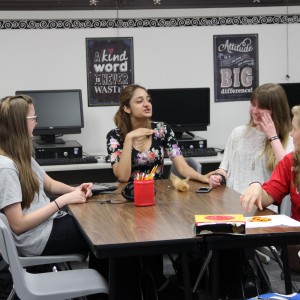 Members of Coppell High School's gay straight alliance (GSA) club sophomore Abbie Hall, junior Megan Goyal, junior Kayla Hale and sophomore Madison Nelson talk with each other before the GSA meeting begins on Sept. 28. The GSA club was created last school year and has continued to grow ever since. Photo by Maggie Theel.