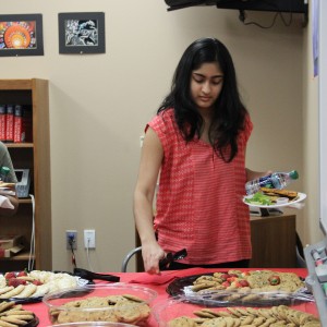 Coppell High School National Merit commended senior Veena Suthendran gets some cookies as a reward for her great achievements on Wednesday in the library. There was 113 students that were nationally recognized for their PSAT scores. Photo by Ale Ceniceros. 