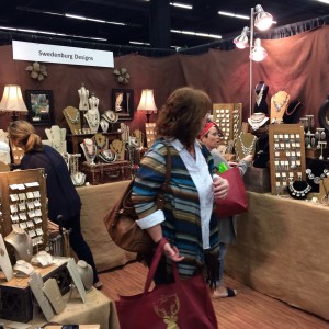 Customers look around the Swendenburg Design booth owned by Tammy Swedenburg at Christmas in Cowtown in the Will Rogers Memorial Center on Saturday. Photo by Kathryn Rudd.
