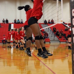 Coppell High School freshman Mykayla Myers warms up blocking before the big game against Trinity High School. The Cowgirls won all three sets, the first with a score of 25-9, 25-17, and 25-11 on Friday night's game in the CHS large gym. Photo by Megan Winkle. 