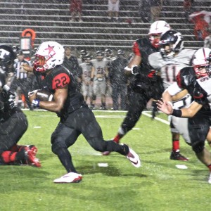 Coppell High School senior running back Brandon Rice runs the ball through Trinitys defense Friday Night at Buddy Echols Field. On Friday night, the Cowboys lost to Trinity, with a final score of 49-14. Photo by Ale Ceniceros. 