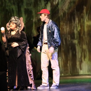 Seniors Arianna Randell and John Alberse perform onstage in the musical “Big Fish” on Oct. 30 at Coppell High School. Randell played The Witch and told Alberse, who played Don Price, what his future held. Photo by Maggie Theel.