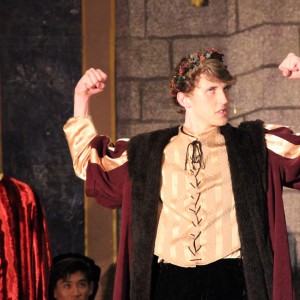 Coppell High School senior and choir member JC Humen acts out his first scene of Friday night’s Madrigals performance. Many people gathered in the CHS large commons on Friday night to enjoy the show put on by CHS choir members. Photo by Amanda Hair. 