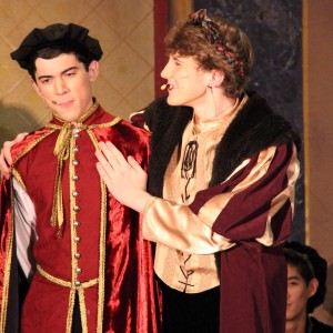 Coppell High School senior Robbie Reyes (left)  and senior JC Humen act out a scene from Friday night's Madrigals performance in the CHS large commons. Guests of all ages were welcomed to the show, and dinner tickets were $30 while dessert tickets cost $10. Photo by Amanda Hair.