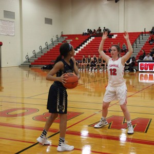 Coppell High School senior shooting guard Kaeli Stayer guards an opposing Keller player, trying to get the ball back under Cowgirl control on Nov 17 at Coppell High School. The Keller Lady Indians defeated the Coppell Cowgirls 28-25. Photo by Aubrie Sisk. 