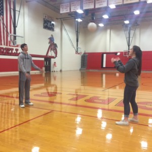 Student teacher Austin Yaeger and Coppell High School sophomore Mariah Kelley toss the volleyball around second period during their partner’s in PE class. "I love this class, working with the kids make my day a thousand times better." Kelley says. 