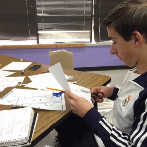 Coppell High School sophomore Gonzalo Argüello works on a puzzle piece of ionic compounds lab today during Susan Sheppard's fourth period Pre AP Chemistry class. Sheppard's class is currently learning about how ionic compounds form and bond.