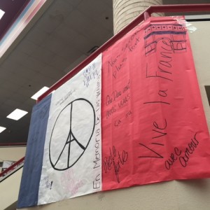 Coppell High School students come together and made a poster to honor the victims of the recent terrorist attack in Paris. All CHS students had a moment of silence in remembrance of the fallen in Paris on Monday. 