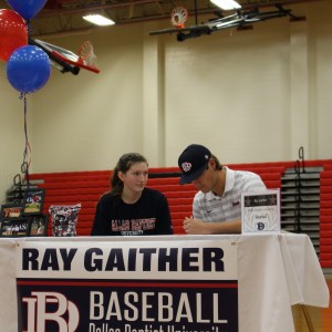 Coppell High School  varsity pitcher and infielder Ray Gaither signs to Dallas Baptist University to play baseball the next four years the morning of Nov. 11 in the CHS large gym, as his sister and CHS sophomore Claire Gaither sits next to him. Nine CHS students signed their letters of intent for various sports on National Signing Day. Photo by Kelly Monaghan.