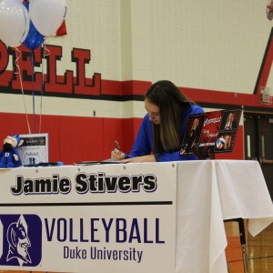  Coppell High School  varsity outside hitter Jamie Stivers signs to play volleyball at  Duke University the morning of Nov. 11, National Signing Day, in the CHS large gym. Stivers committed to Duke over a year ago and head coach Julie Green says, “she has never looked back.” Photo by Kelly Monaghan.