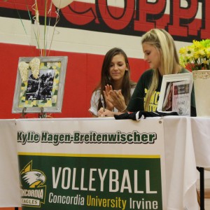 Coppell High School  varsity middle hitter Kylie Hagen-Breitenwischer signs to Concordia University Irvine for volleyball on Nov. 11, National Signing Day, in the CHS large gym. Several students, coaches, and family members gathered to watch the nine CHS students sign their letters of intent to play sports in college. Photo by Kelly Monaghan.