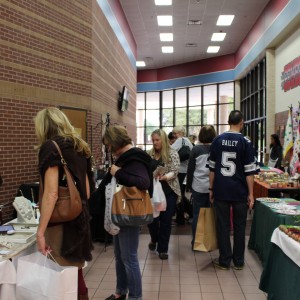 Coppell residents shop at the 20th annual Holiday House on Nov. 15. Many vendors from Dallas as well as local stores came to sell Christmas goods as well as food and clothes at the event put on by CHS Project Graduation. Photo by Kelly Monaghan.