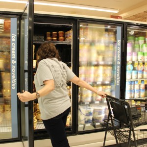 Kathy Arndt looks in the frozen section to see what flavors of Blue Bell are available on Nov. 2. The ice cream company recalled their products earlier in the year to a listeria outbreak but returned to the Dallas area Monday morning. Photo by Kelly Monaghan.