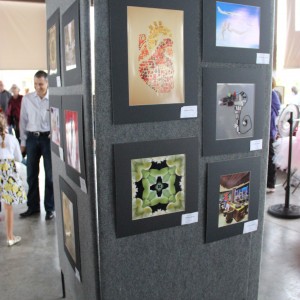 The artworks of Coppell High School AP Art students are proudly featured at the Coppell Arts Festival on Oct. 31. Among the artworks included are pieces that AP Art 2D Design students created using photoshop. Photo by Ayoung Jo. 