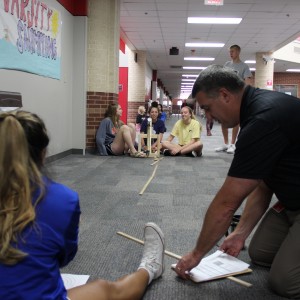 Karl Gscheidle’s Physics class constructs catapults in order to test velocity and the distance they cover. Trials and test runs take place monday in the main hallway of Coppell High School. Photo by Chelsea Banks.  