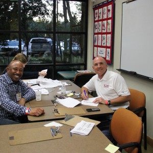 Coppell city council member Marvin Franklin and Texas state representative Bennett Ratliff smile for the camera at the Taste of Coppell on Nov.8. Franklin and Ratliff were two of the eight individuals judging the restaurants at the event. Photo by Ayoung Jo. 