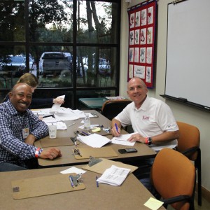 Coppell city council member Marvin Franklin and Texas state representative Bennett Ratliff smile for the camera at the Taste of Coppell on Nov.8. Franklin and Ratliff were two of the eight individuals judging the restaurants at the event. Photo by Ayoung Jo.