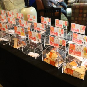 Voting boxes are set up near the exit of the Taste of Coppell Nov. 8. at the Senior and Community Center, where visitors can vote for their favorite restaurants of the evening as they leave the event. The restaurants that received the Top Taste awards were J Macklin’s Grill, Zenzero Kitchen and Carmel Restaurants and Lounge. Photo by Ayoung Jo. 