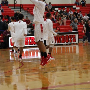 Coppell High School senior guard Alex Vuchkov warms up to defeat Mansfield Timberview. The Cowboys beat the Wolves Friday at home in the large gym 54-52.